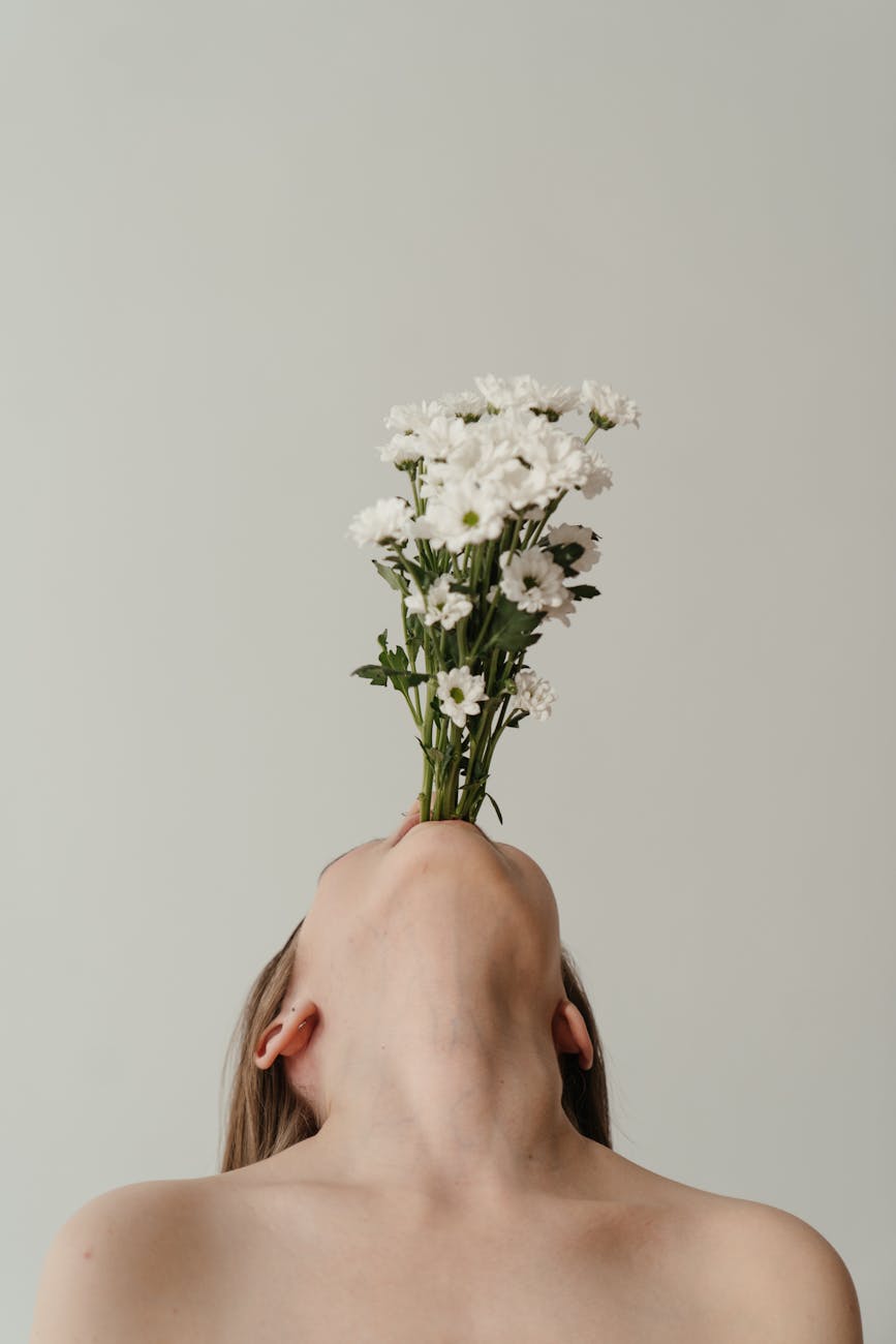 woman holding white flower bouquet