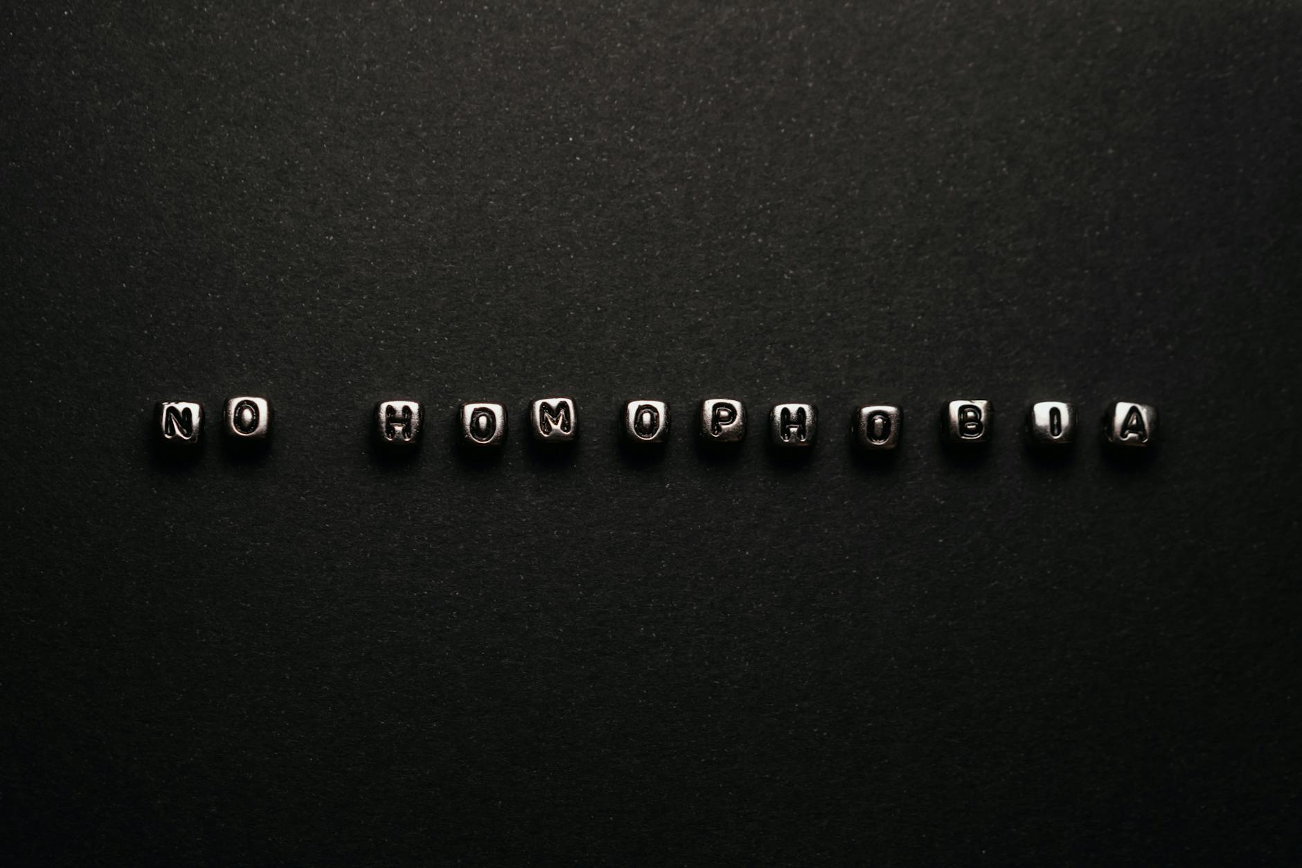 silver letter beads on a black surface