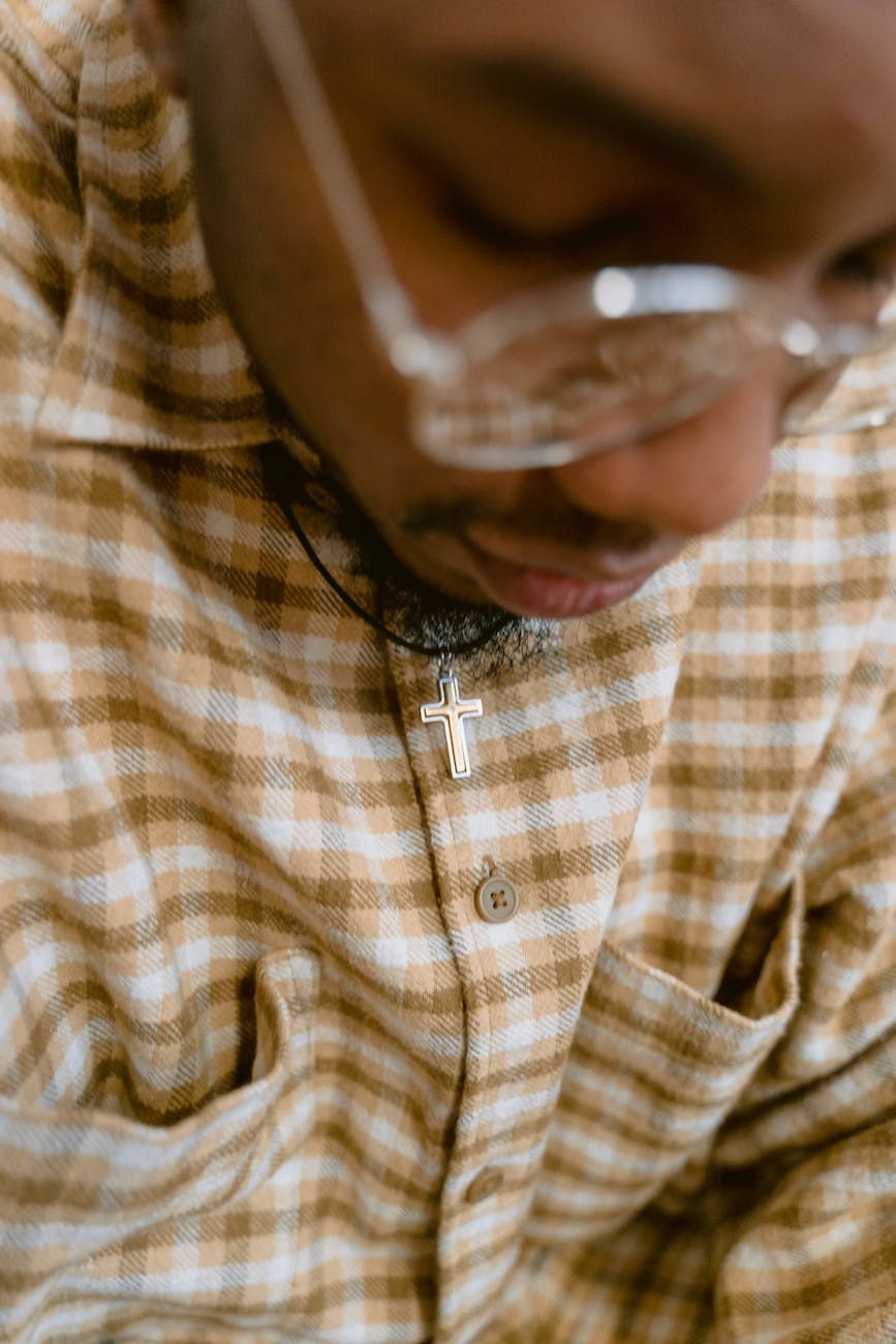 man in brown and white plaid button up shirt